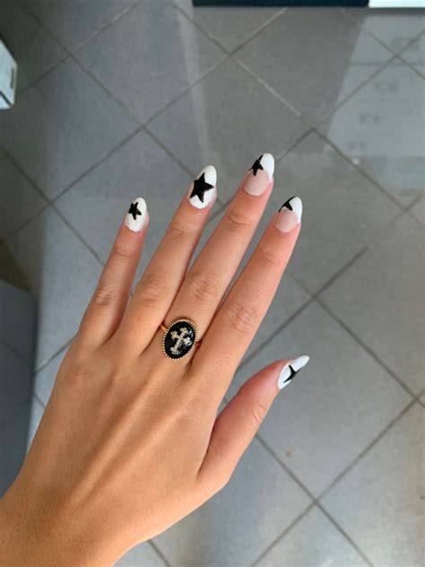 white nails with black stars|black and white french nails.